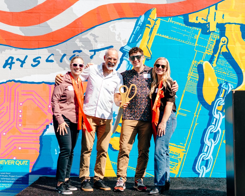 American Crane Dedicates New Mural with Colorful Ribbon-Cutting Celebration